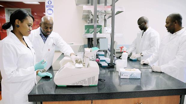 DPhD fellows Zandile Sibisi, from left, Benjamin Chimukangara, Mlungisi Dlamini and Dr Tongo Marcel work on the state-of-the-art DNA sequencing machines at the KZN Research and Innovation Sequencing Platform (KRISP) centre, based at UKZN