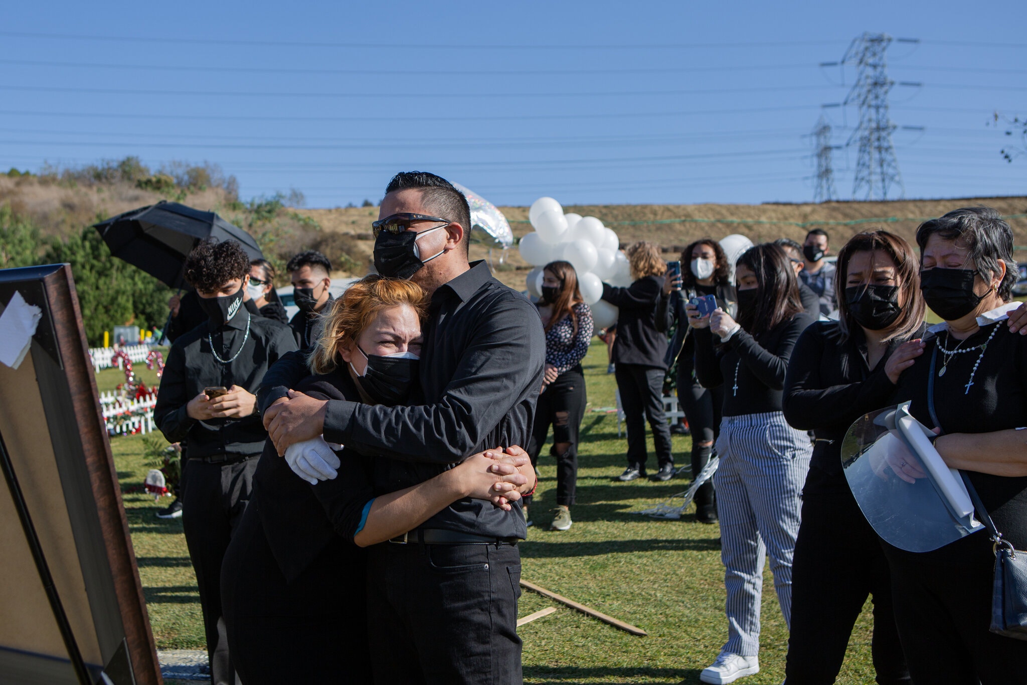Family members mourn the death of Gilberto Arreguin, who died from complications of Covid-19, in Los Angeles in late December. Credit...Alex Welsh for The New York Times