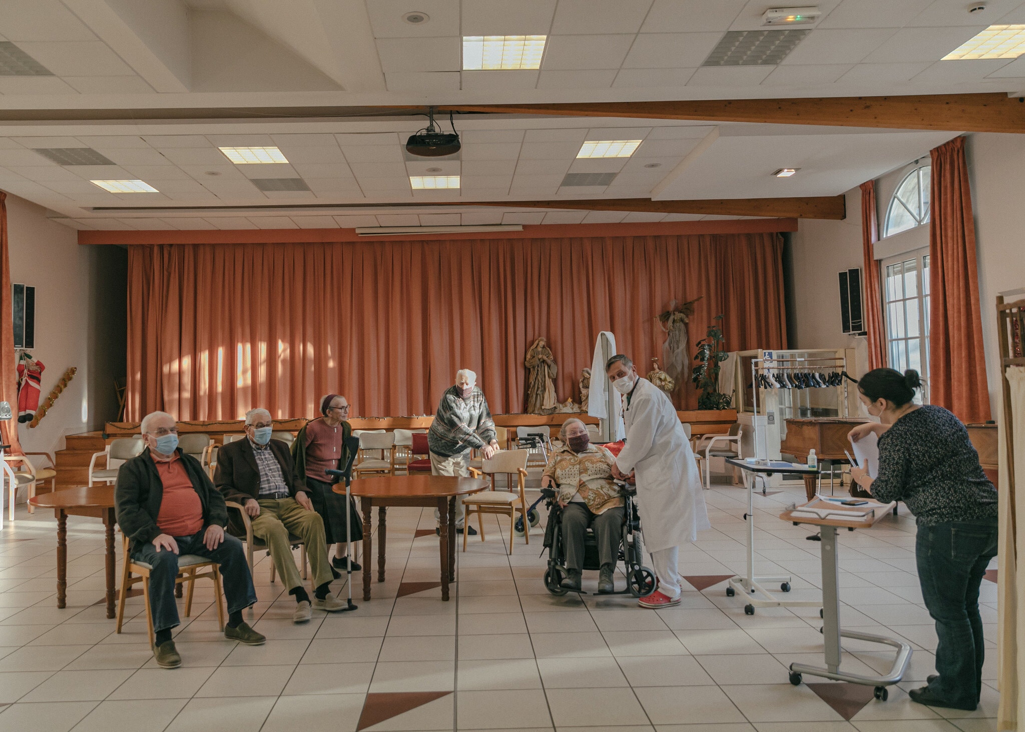 Preparing residents for vaccinations at a nursing home in Reims, France, on Friday.Credit...Andrea Mantovani for The New York Times